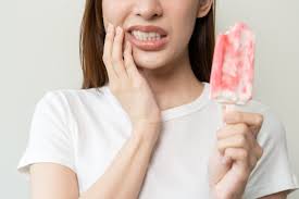 Tooth sensitive to cold caused by enamel erosion and exposed dentin